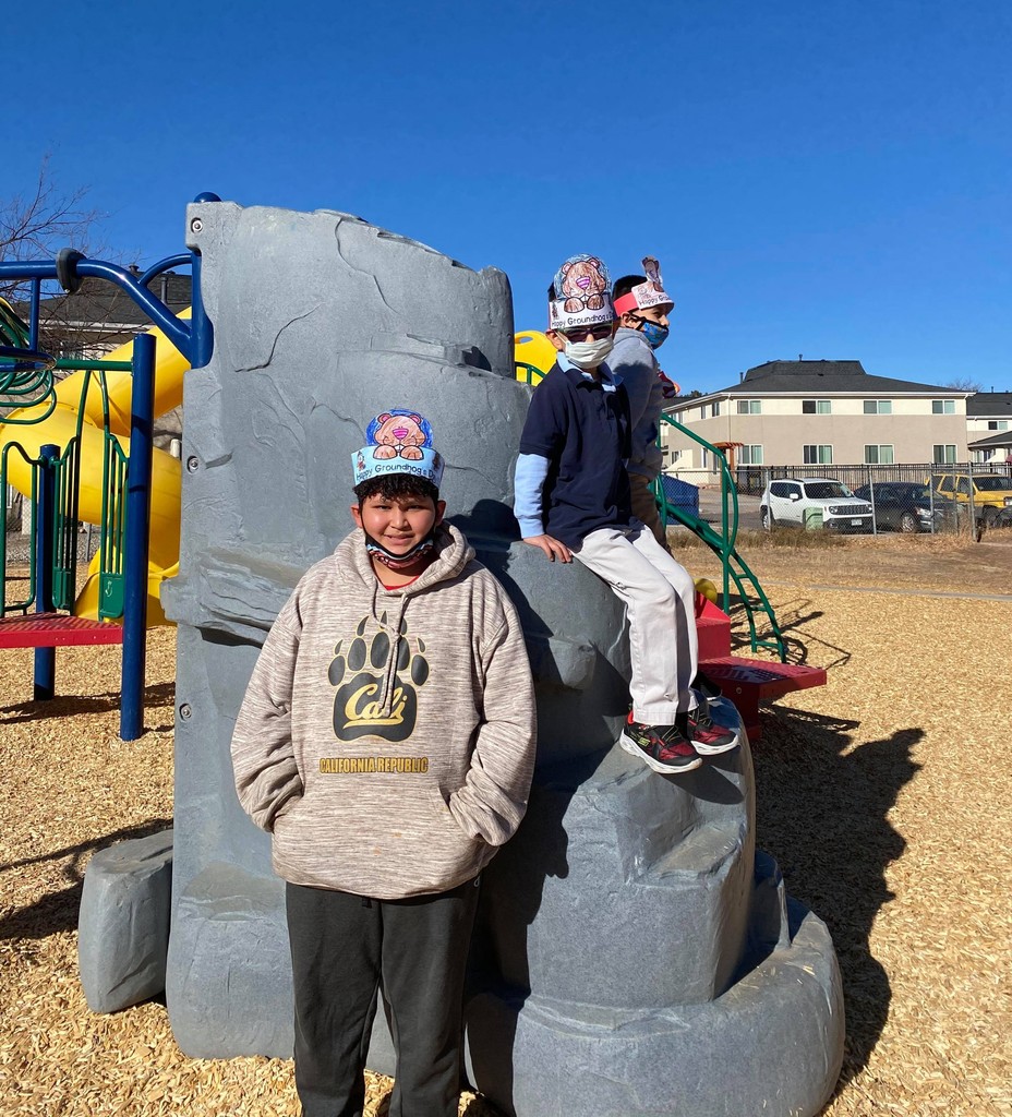 3 boys on playground equipment
